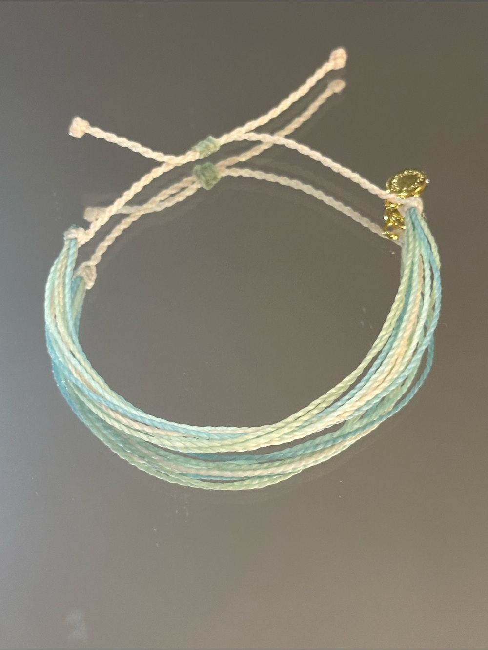 Pura Vida.  Aqua and Cream Multi-Strand Bracelet with Gold Charm